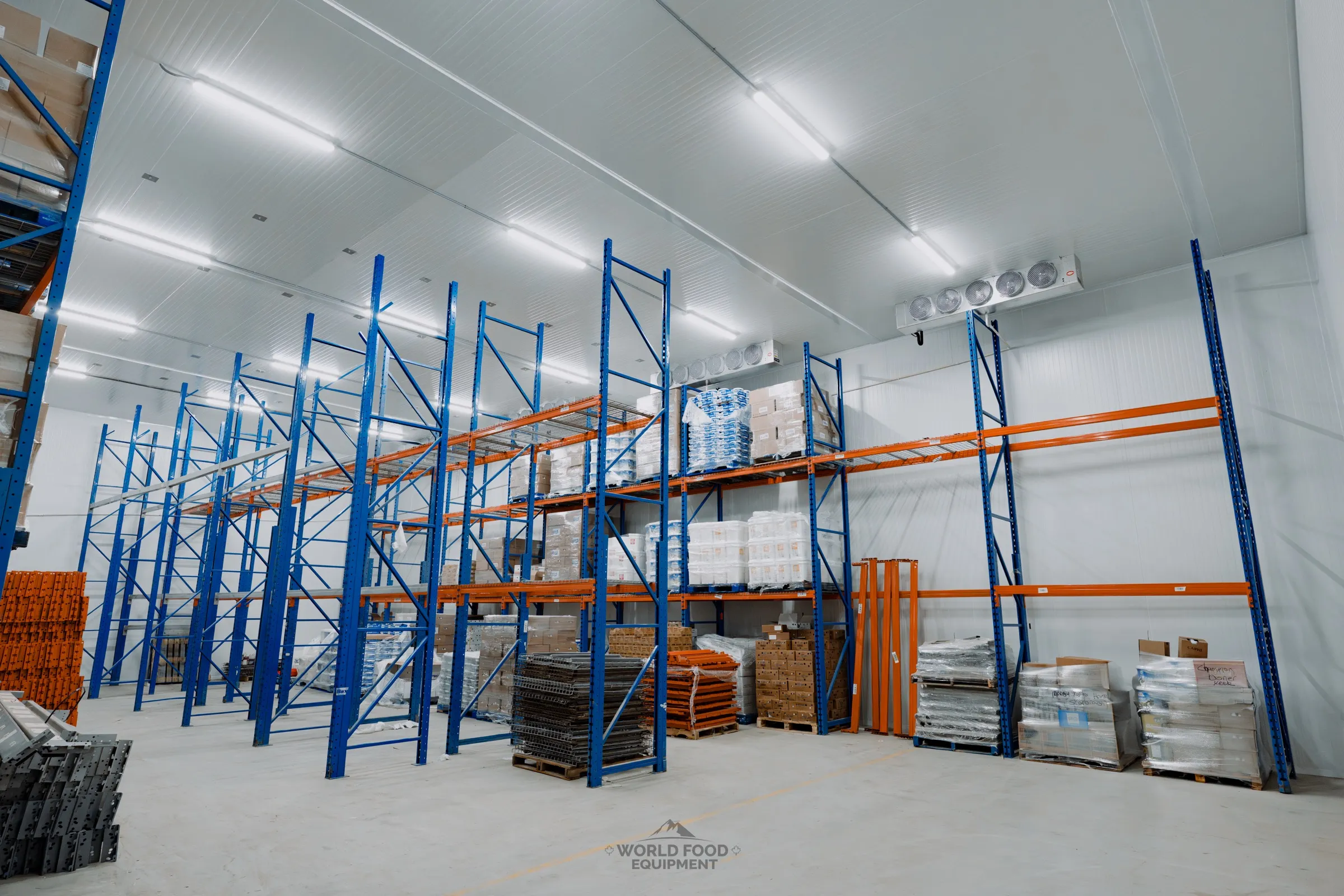 Stocked walk-in cooler at the Atlas Foods 30-day build with pallet racking floor to ceiling, Toronto specialty food distribution.
