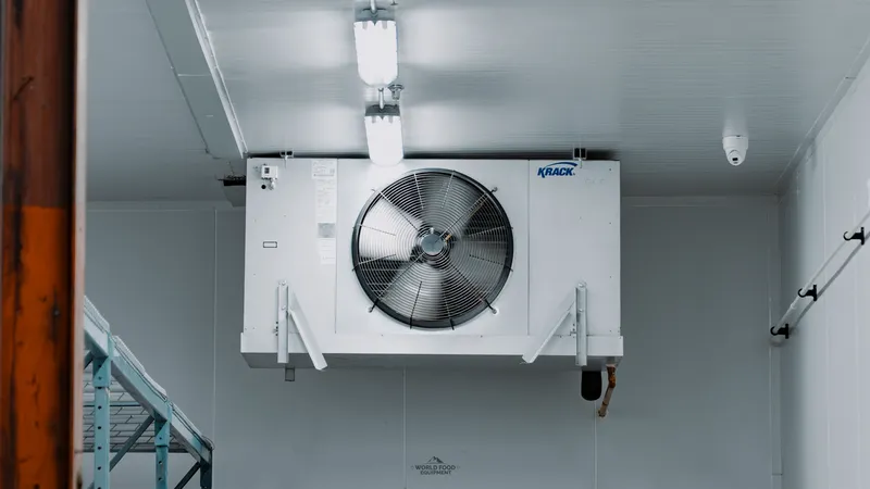 Commercial refrigeration repair technician servicing walk-in cooler, Ontario